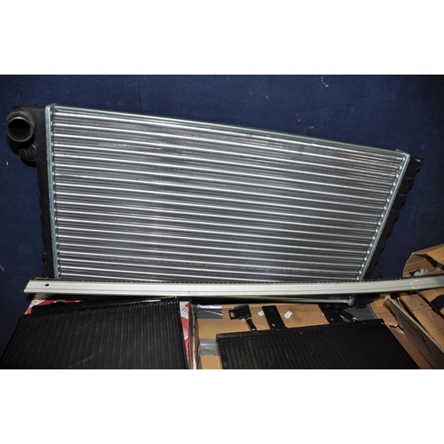 1299 - FOUR NEW BUT SLIGHTLY DAMAGED CAR RADIATORS in boxes no indication of makes or models of vehicles th... 