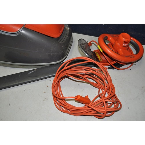 1321 - A FLYMO TURBO COMPACT 350 HOVER VAC model NoTC350 and a FLYMO easy-trim hedge trimmer model No EHT35... 