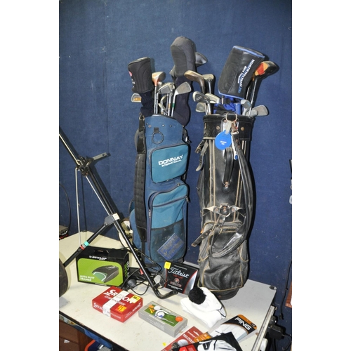 1365 - A SELECTION OF GOLFING EQUIPMENT to include two golf bags containing various clubs, a manual/push al... 