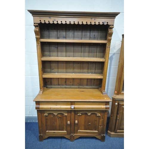 1569 - A PINE DRESSER with two drawers, width 121cm x depth 47cm x height 209cm, and a pine glazed corner c... 