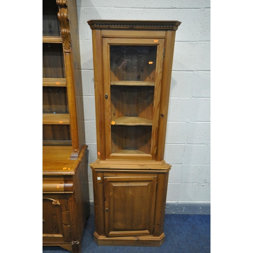 1569 - A PINE DRESSER with two drawers, width 121cm x depth 47cm x height 209cm, and a pine glazed corner c... 