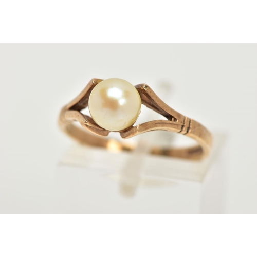 101 - A 9CT GOLD CULTURED PEARL DRESS RING, designed as a single cultured pearl with yellow gold bifurcate... 