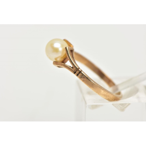 101 - A 9CT GOLD CULTURED PEARL DRESS RING, designed as a single cultured pearl with yellow gold bifurcate... 