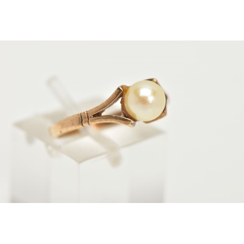 101 - A 9CT GOLD CULTURED PEARL DRESS RING, designed as a single cultured pearl with yellow gold bifurcate... 