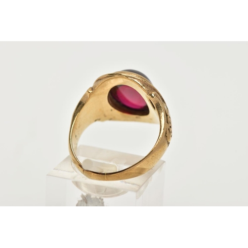 109 - A YELLOW METAL AND GARNET RING, an oval cabochon garnet, set in a yellow metal, signed '3 PARA' 'WHO... 