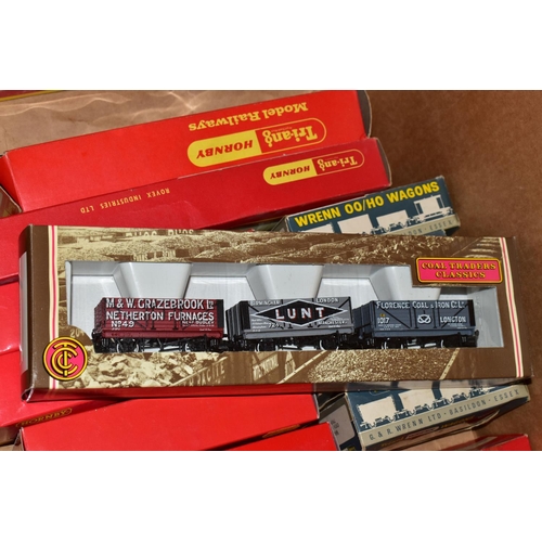 214 - A QUANTITY OF MAINLY BOXED OO GAUGE MODEL RAILWAY ROLLING STOCK, to include boxed Tri-ang Wrenn and ... 