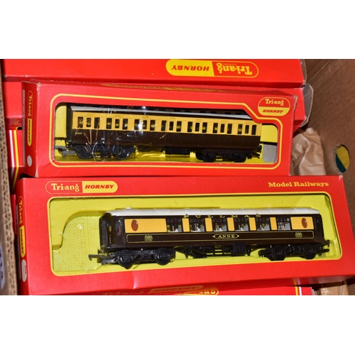 214 - A QUANTITY OF MAINLY BOXED OO GAUGE MODEL RAILWAY ROLLING STOCK, to include boxed Tri-ang Wrenn and ... 