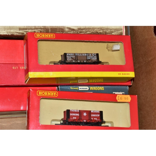 214 - A QUANTITY OF MAINLY BOXED OO GAUGE MODEL RAILWAY ROLLING STOCK, to include boxed Tri-ang Wrenn and ... 