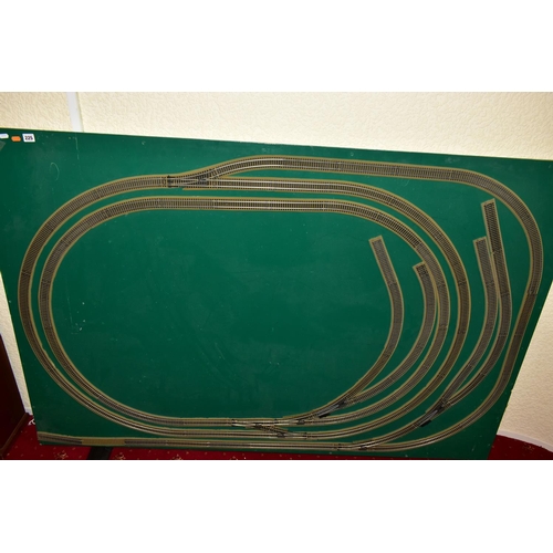 225 - A OO GAUGE MODEL RAILWAY LAYOUT, double oval of track, with a long branch line and four sidings (two... 