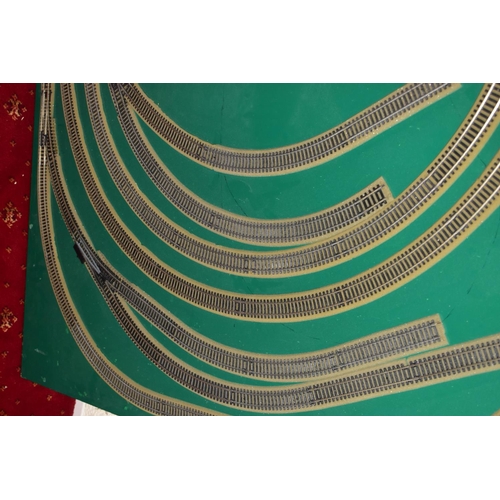 225 - A OO GAUGE MODEL RAILWAY LAYOUT, double oval of track, with a long branch line and four sidings (two... 