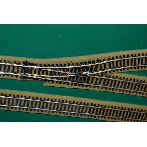 225 - A OO GAUGE MODEL RAILWAY LAYOUT, double oval of track, with a long branch line and four sidings (two... 