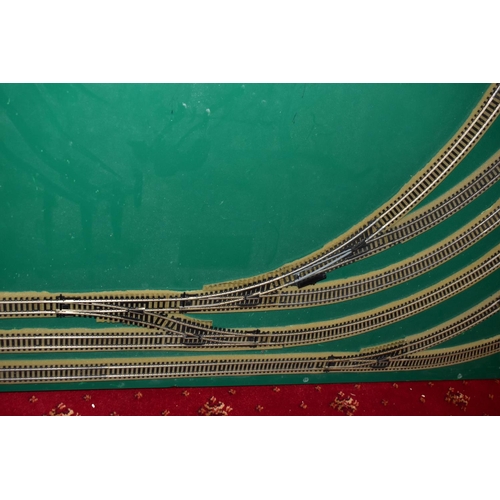 225 - A OO GAUGE MODEL RAILWAY LAYOUT, double oval of track, with a long branch line and four sidings (two... 