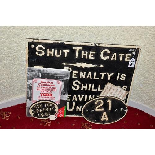 226 - A CAST IRON SHUT THE GATE PENALTY NOTICE, raised white lettering and edge surround on black backgrou... 