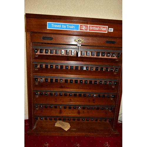 227 - A WOODEN BRITISH RAILWAYS TICKET CABINET,  lockable cabinet with roller shutter front which opens to... 