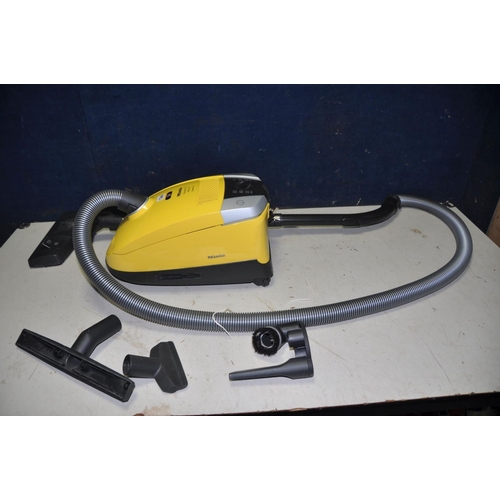 1344 - A MIELE C3 COMPACT VACUUM CLEANER with various attachments (PAT pass and working)