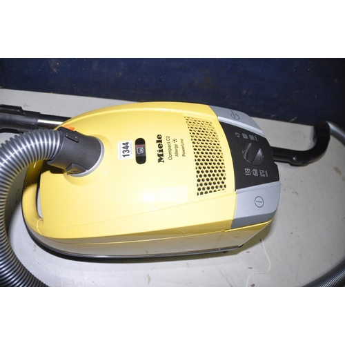 1344 - A MIELE C3 COMPACT VACUUM CLEANER with various attachments (PAT pass and working)