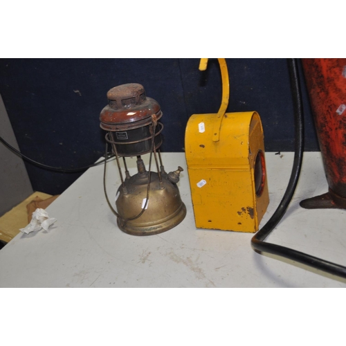 1358 - A VINTAGE OIL DISPENSER with a Baelz hand pump and badged Shell, a vintage Duckhams 5 Gallon oil dru... 