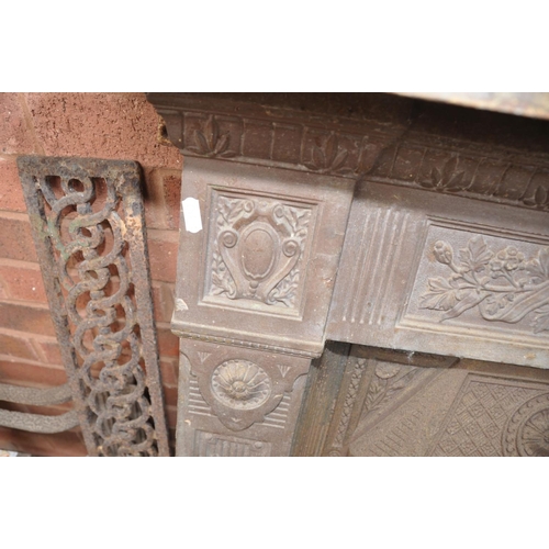 1363 - A CAST IRON FIRE SURROUND, with foliate and columned detailing, 'The Scotia' to the centre, along wi... 