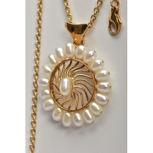 10 - AN 18CT GOLD CULTURED PEARL NECKLACE, an open work yellow gold wheel design pendant, set with ninete... 