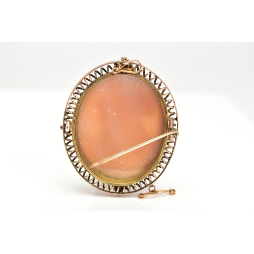 106 - A YELLOW METAL CAMEO BROOCH, of an oval form, depicting a lady in profile with a flower in her hair,... 