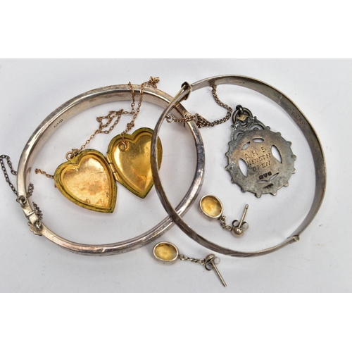 108 - TWO SILVER HINGED BANGLES AND OTHER ITEMS, the first bangle designed with an engraved scrolling foli... 