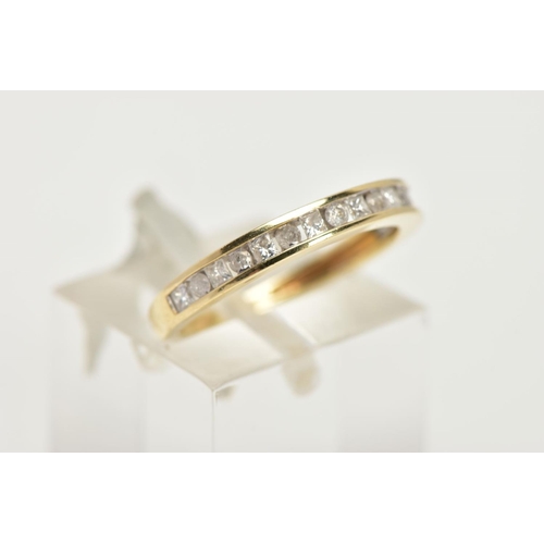 116 - A 9CT GOLD DIAMOND HALF ETERNITY RING, designed with a row of alternating round brilliant cut and pr... 