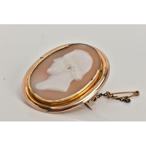 120 - A VICTORIAN CAMEO BROOCH, oval cameo depicting a gentleman in profile, the back has a personal engra... 