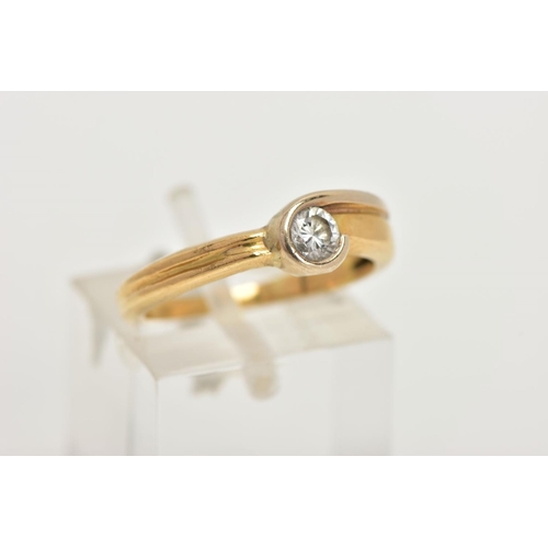 122 - A YELLOW METAL SINGLE STONE DIAMOND, round brilliant cut diamond within a wrap around mount, estimat... 