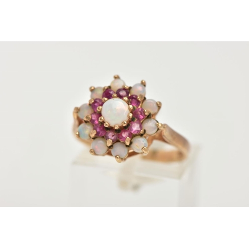 127 - A 9CT GOLD RUBY AND OPAL CLUSTER RING, tiered cluster set with a central circular opal cabochon to a... 