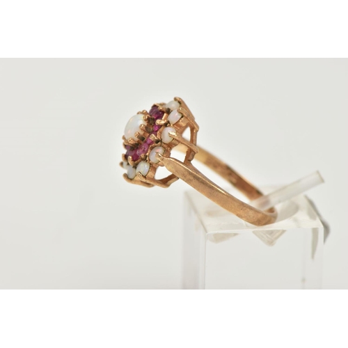 127 - A 9CT GOLD RUBY AND OPAL CLUSTER RING, tiered cluster set with a central circular opal cabochon to a... 