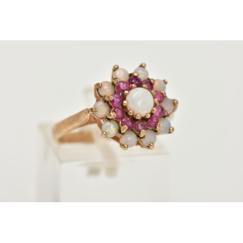 127 - A 9CT GOLD RUBY AND OPAL CLUSTER RING, tiered cluster set with a central circular opal cabochon to a... 