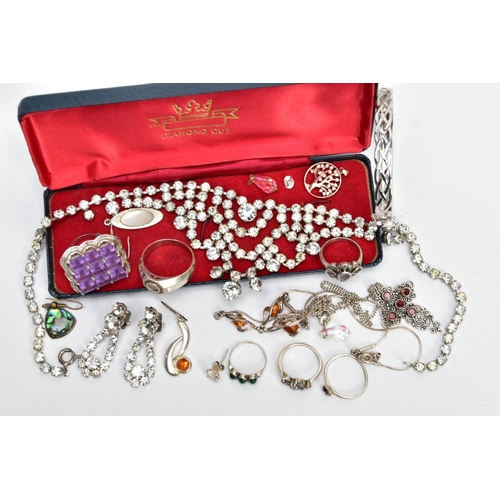 131 - A BAG OF JEWELLERY, to include a silver Celtic designed hinged bangle, fitted with a latch clasp and... 