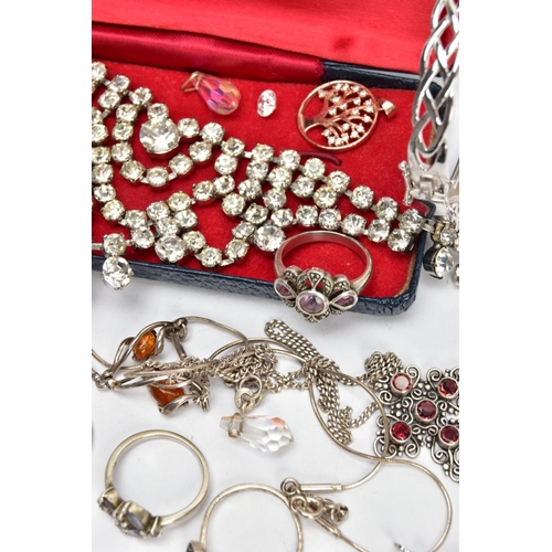 131 - A BAG OF JEWELLERY, to include a silver Celtic designed hinged bangle, fitted with a latch clasp and... 