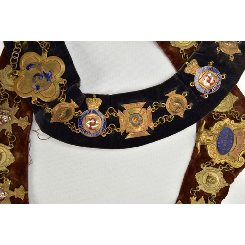 136 - TWO MASONIC COLLARS, the first a blue suede collar set with various metal enamelled medals, inside c... 