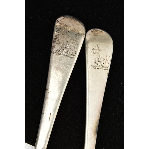 142 - TWO SILVER SERVING SPOONS, old English pattern design with engraved crests to the terminals, each ha... 