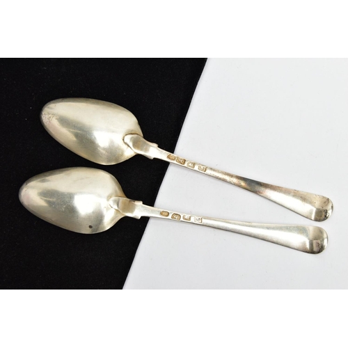 142 - TWO SILVER SERVING SPOONS, old English pattern design with engraved crests to the terminals, each ha... 