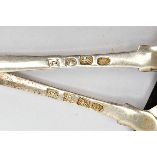 142 - TWO SILVER SERVING SPOONS, old English pattern design with engraved crests to the terminals, each ha... 