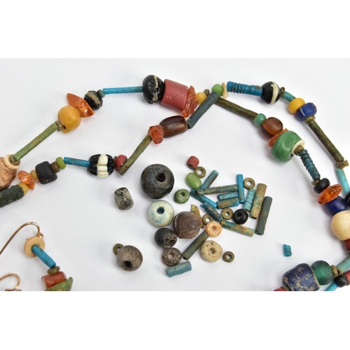 143 - AN ANCIENT EGYPTIAN FAIENCE BEAD NECKLACE, faience and hardstone beaded necklace also featuring a sc... 