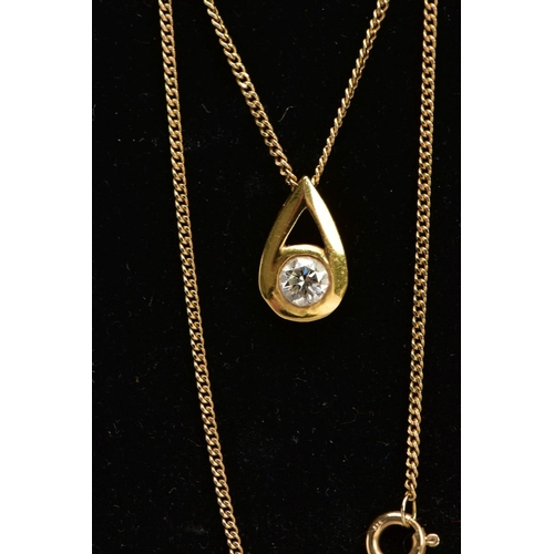 15 - A 9CT GOLD DIAMOND NECKLACE, a pear shaped yellow gold pendant set with a round brilliant cut diamon... 