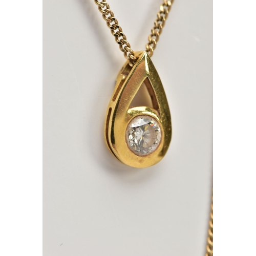 15 - A 9CT GOLD DIAMOND NECKLACE, a pear shaped yellow gold pendant set with a round brilliant cut diamon... 