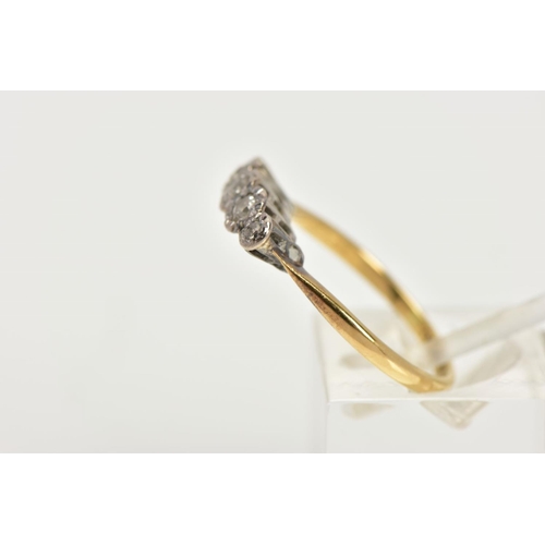 18 - A YELLOW METAL FIVE STONE DIAMOND RING, five old cut diamonds in a white metal illusion setting, app... 