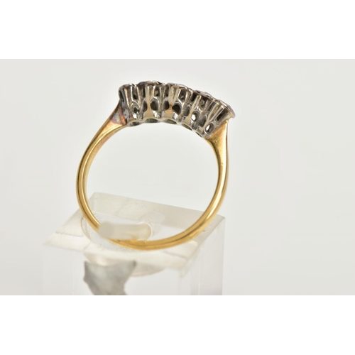 18 - A YELLOW METAL FIVE STONE DIAMOND RING, five old cut diamonds in a white metal illusion setting, app... 