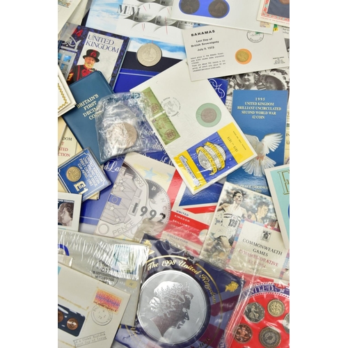 209 - A CARDBOARD BOX CONTAINING COIN AND STAMP PACKS, ROYAL MINT COIN AND YEAR PACKS, to include BU sets ... 