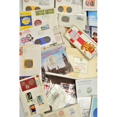 209 - A CARDBOARD BOX CONTAINING COIN AND STAMP PACKS, ROYAL MINT COIN AND YEAR PACKS, to include BU sets ... 