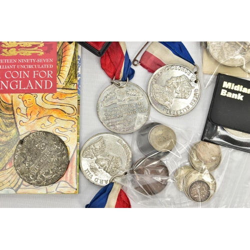 212 - A PLASTIC TUB OF COINS AND COMMEMORATIVES, to include two WWII defence medals, a 1997 royal mint car... 