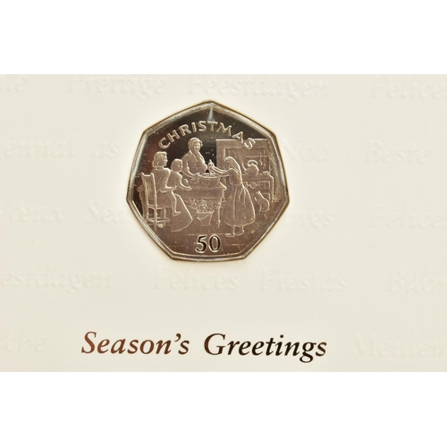 225 - FOUR ISLE OF MAN CHRISTMAS GREETINGS CARDS WITH DIAMOND FINISH FIFTY PENCE COINS, to include 1997 t ... 