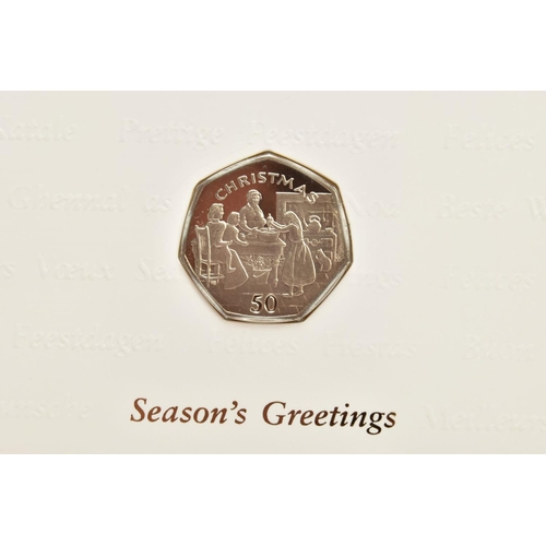 226 - FOUR ISLE OF MAN CHRISTMAS GREETINGS CARDS WITH DIAMOND FINISH FIFTY PENCE COINS, to include 1990 bb... 