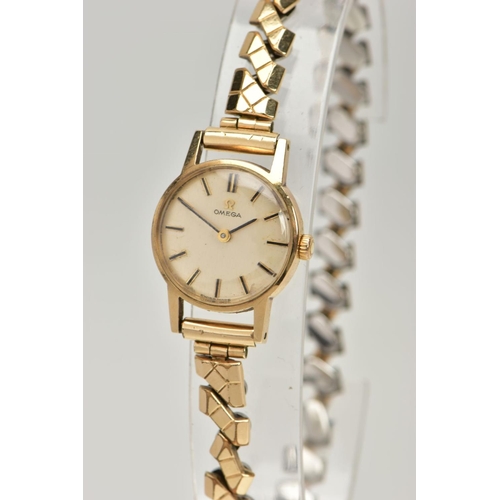 233 - A LADIES 9CT GOLD 'OMEGA' WRISTWATCH, round gold dial signed 'Omega', baton markers, black hands, wi... 