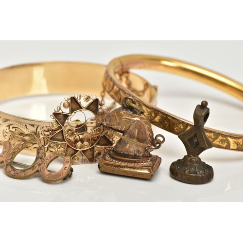 35 - TWO GOLD PLATED HINGED BANGLES, TWO FOB SEALS AND A PENDANT, to include a floral engraved hinged ban... 