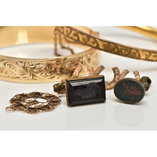 35 - TWO GOLD PLATED HINGED BANGLES, TWO FOB SEALS AND A PENDANT, to include a floral engraved hinged ban... 